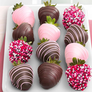 Chocolate covered strawberries with pink glaze drizzle and sprinkles