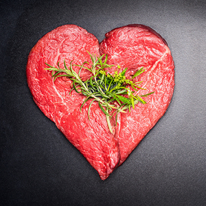 heart-shaped sirloin with rosemary and herbs on top